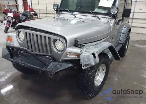 2000 Jeep Wrangler Sport z USA, uszkodzony, nr VIN 1J4FA49S2YP797321